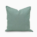 Solid light blue pillow on a white background