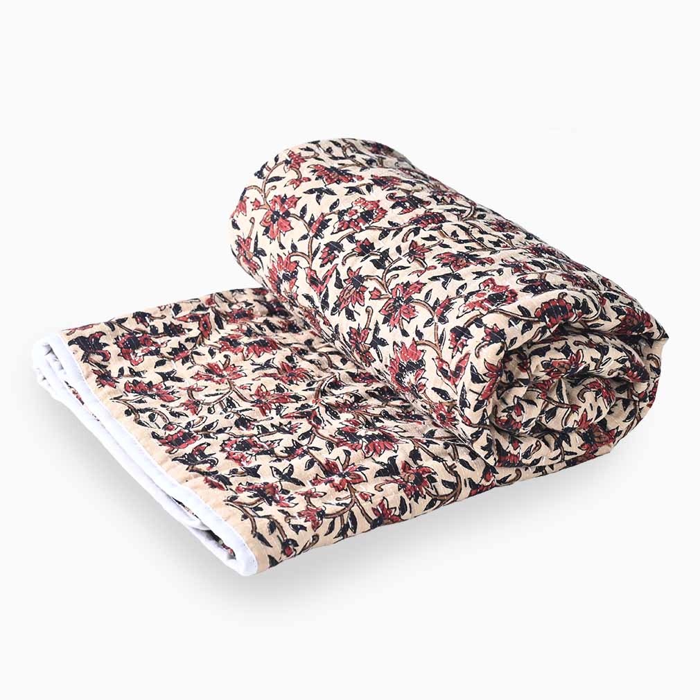 Roll of floral fabric on a white background