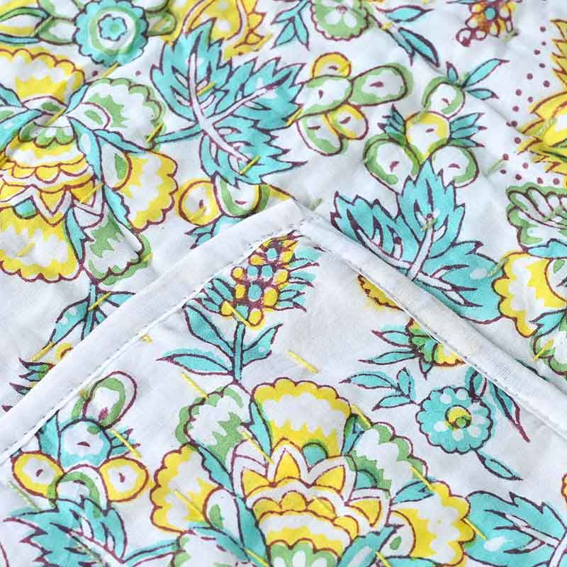 Colorful floral patterned fabric with a white background