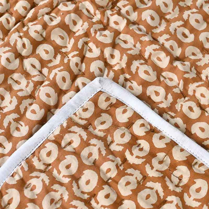 Brown fabric with white abstract pattern