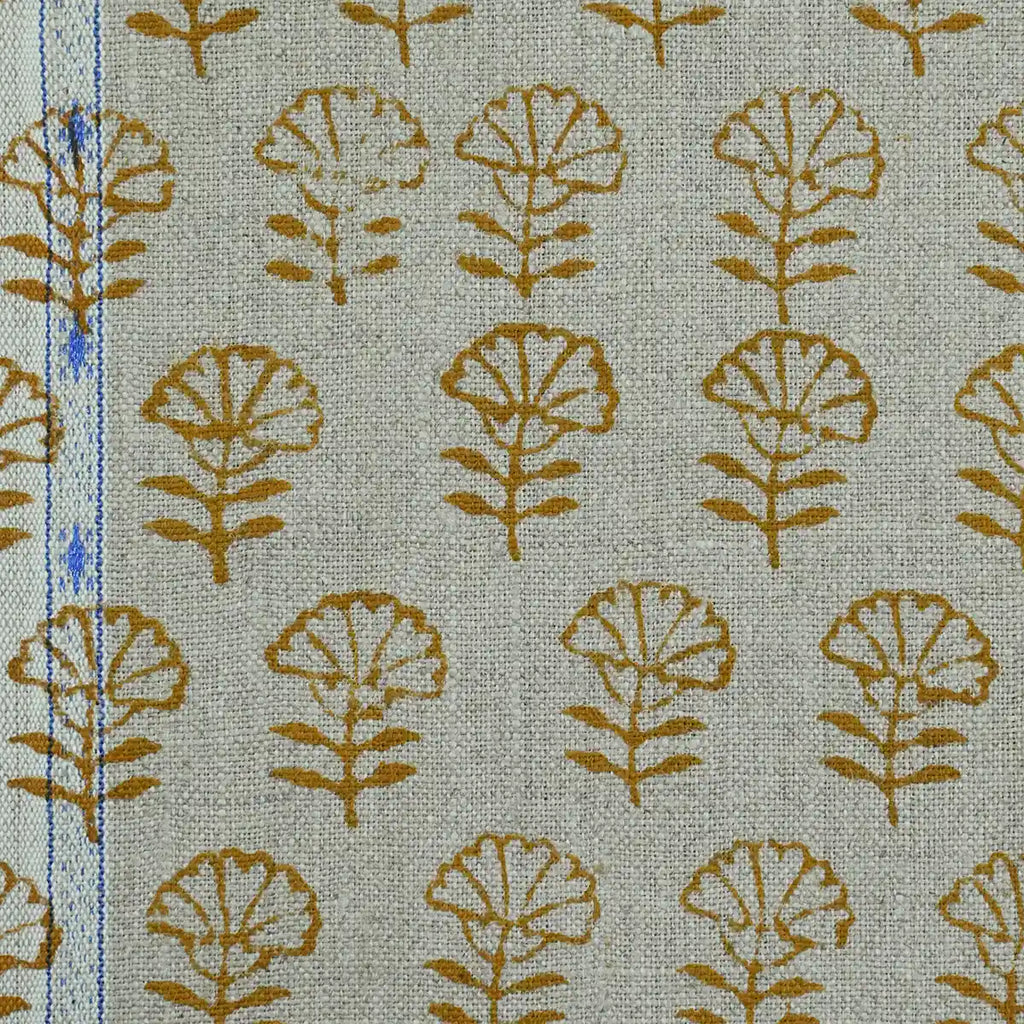 Textile with brown leaf pattern on a light green background