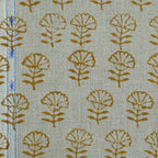 Textile with brown leaf pattern on a light green background