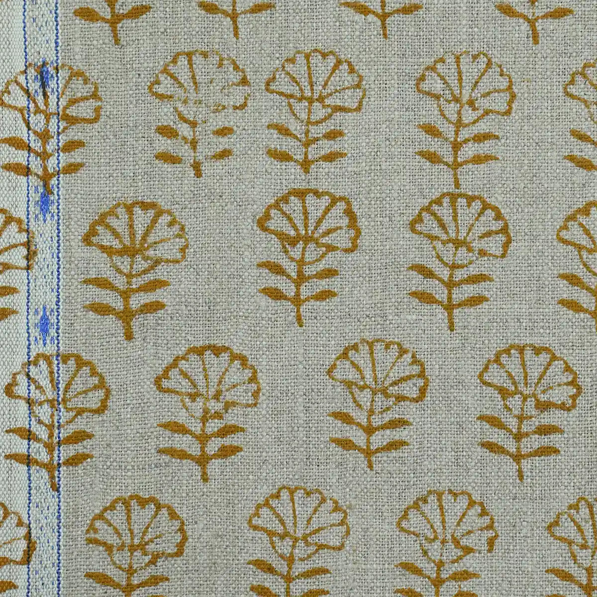 Textile with brown leaf pattern on a light green background
