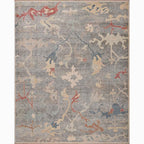 Decorative rug with abstract floral pattern on a gray background