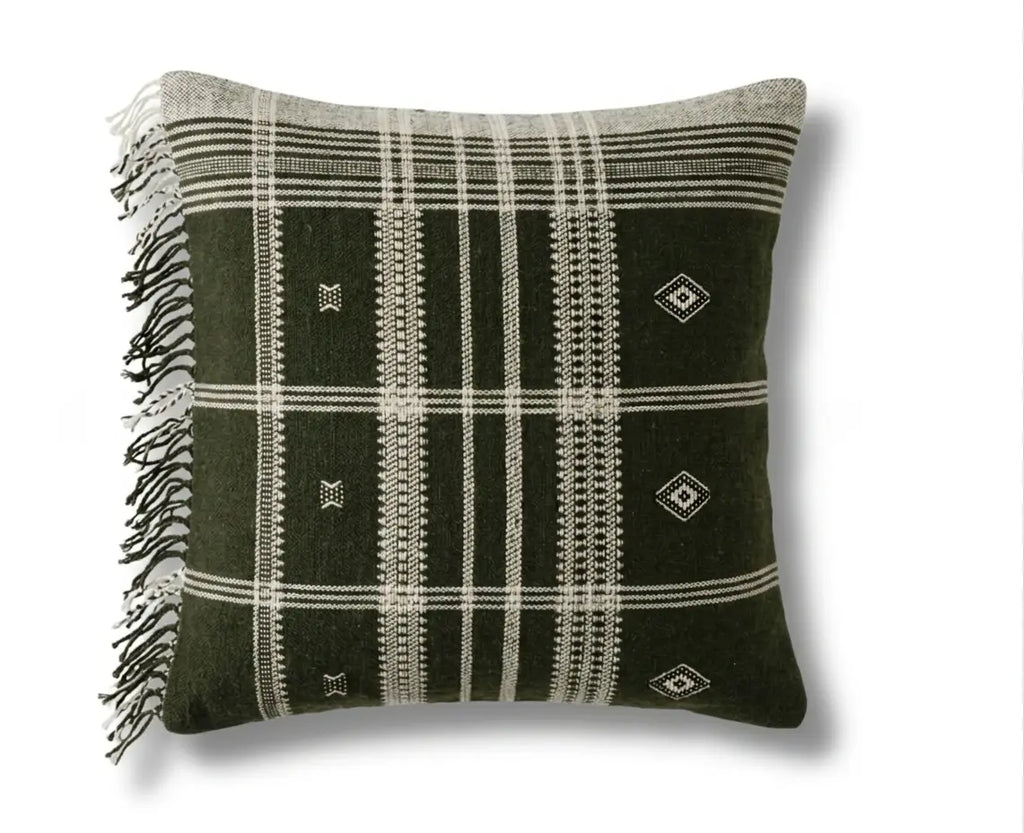 Decorative pillow with black and white plaid pattern and fringe on a white background