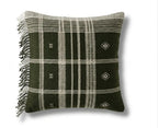 Decorative pillow with black and white plaid pattern and fringe on a white background