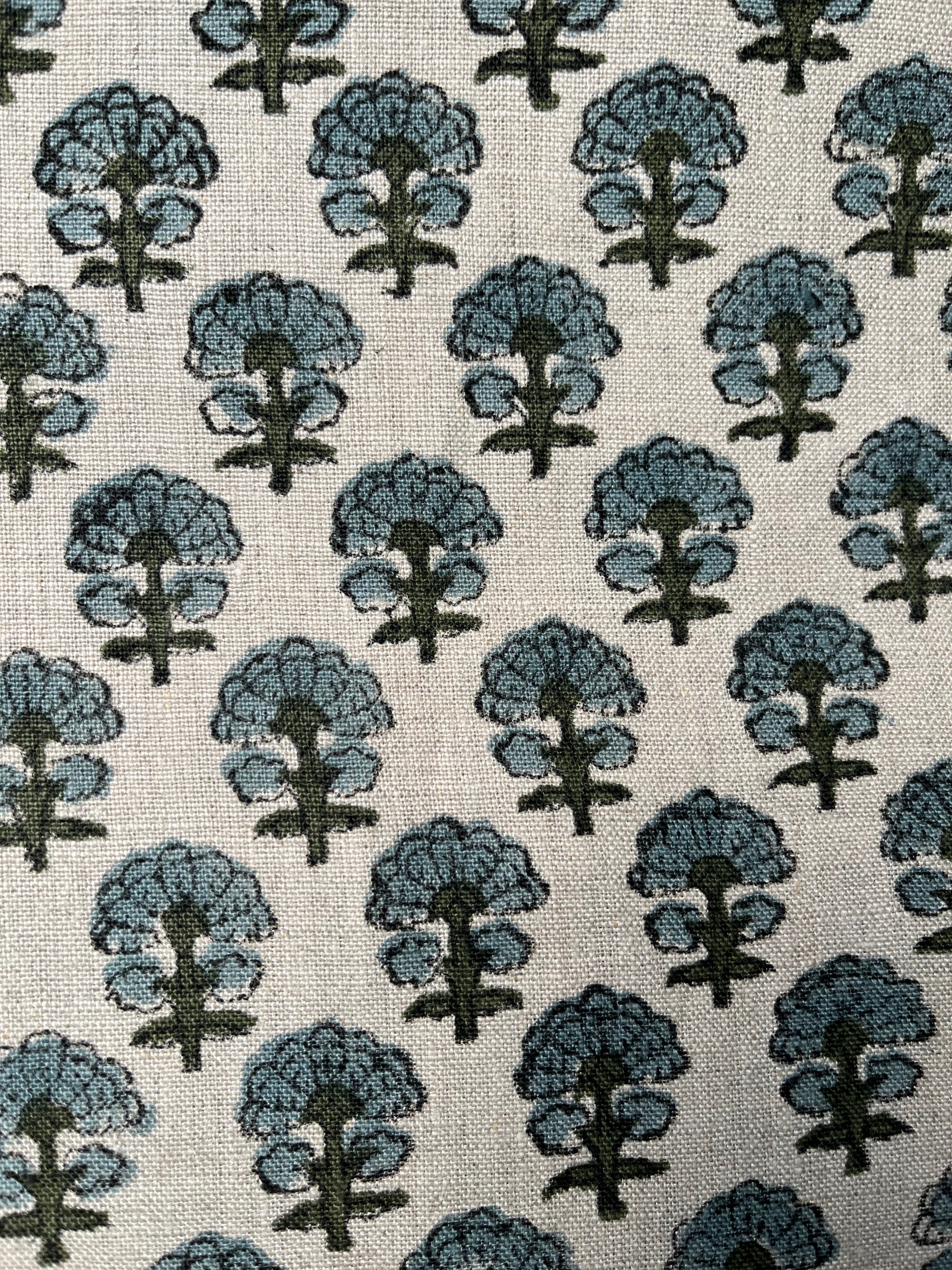Pattern of blue trees on a beige background