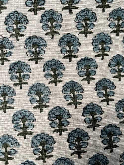 Pattern of blue trees on a beige background