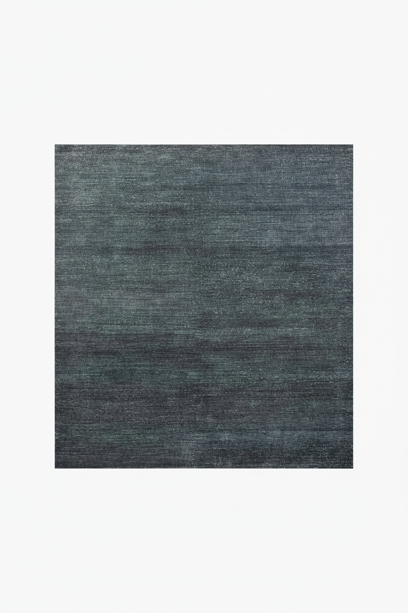 Rectangular dark gray rug on a white background