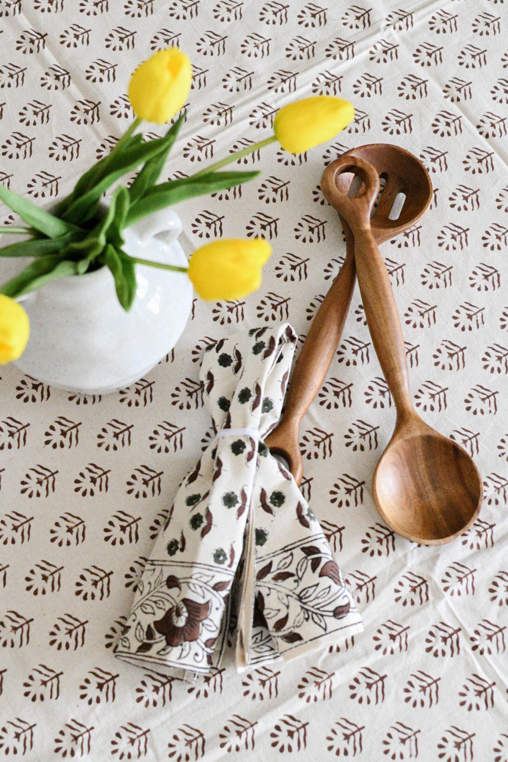 Close‑up of brown floral buti block print on cotton napkin