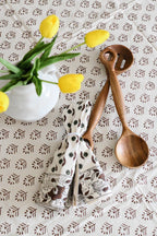 Close‑up of brown floral buti block print on cotton napkin