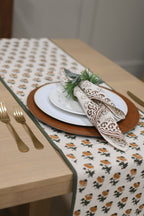 Close‑up of brown floral buti block print on cotton napkin