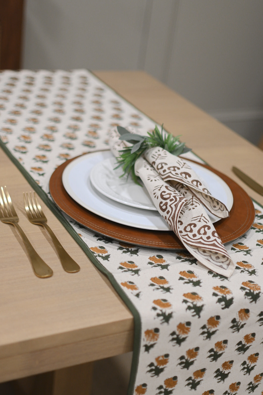 Close‑up of brown floral buti block print on cotton napkin