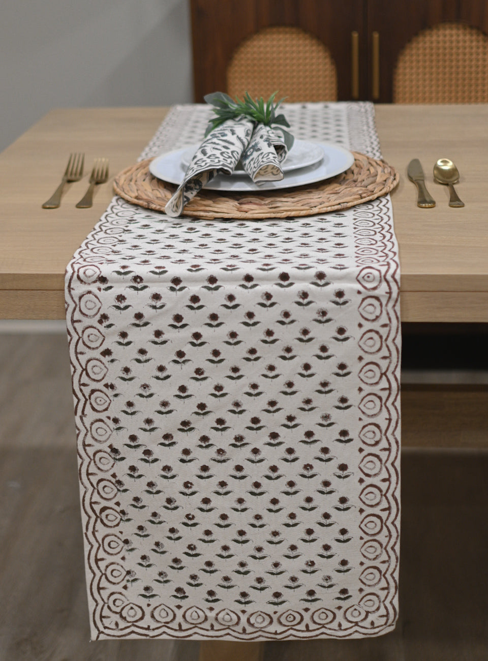 White and rosewood block printed table runner styled on a dining table