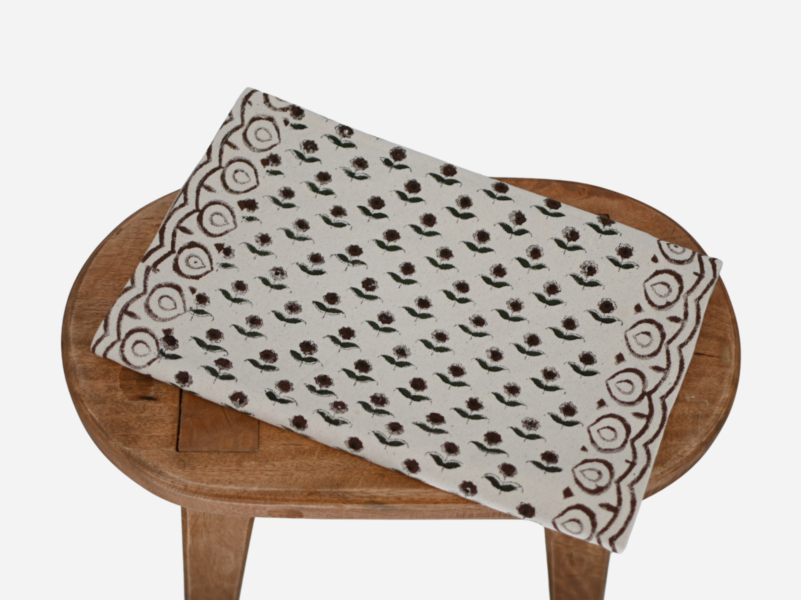 Close‑up of rosewood floral buti block print on cotton‑linen table runner
