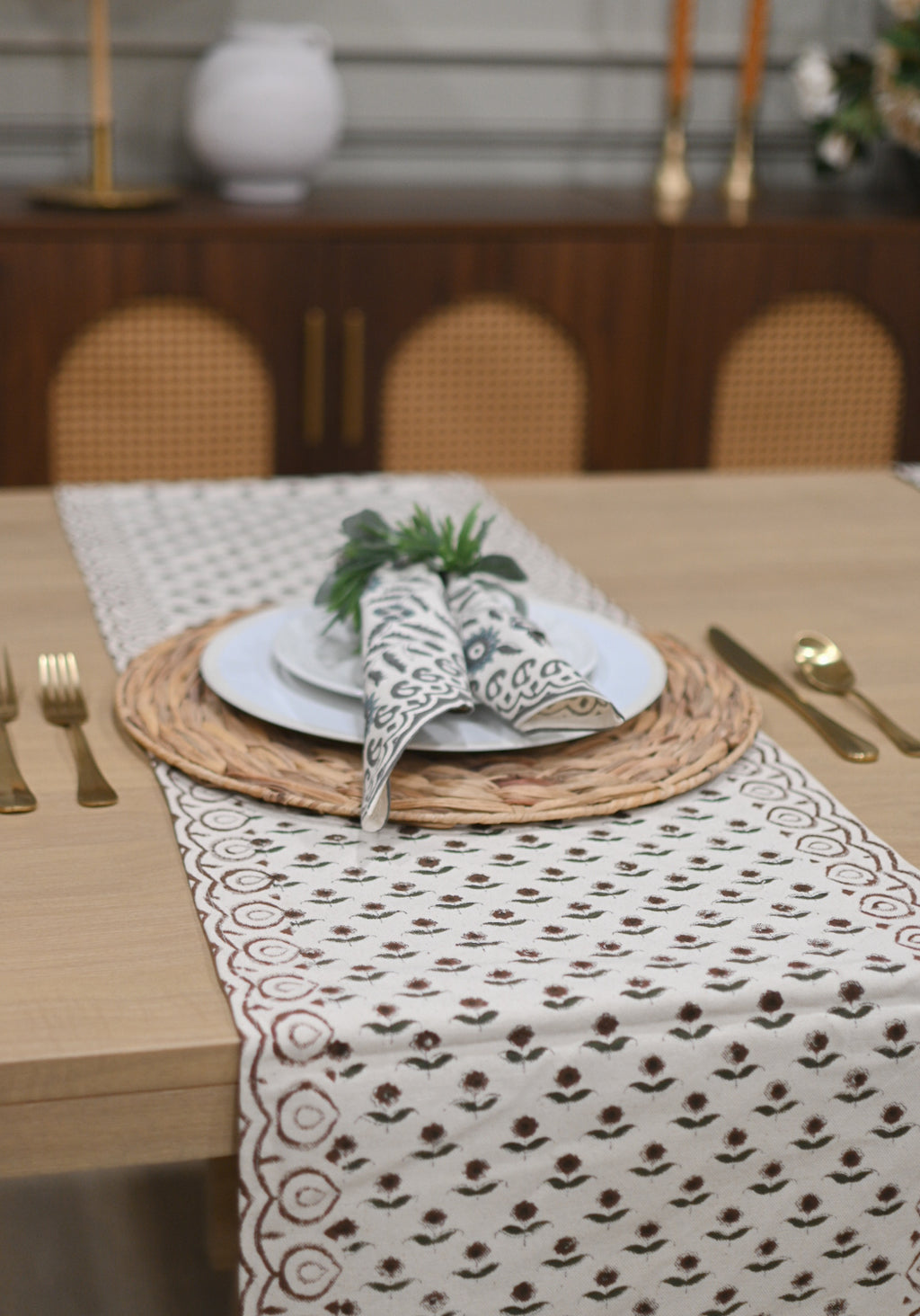 Close‑up of rosewood floral buti block print on cotton‑linen table runner