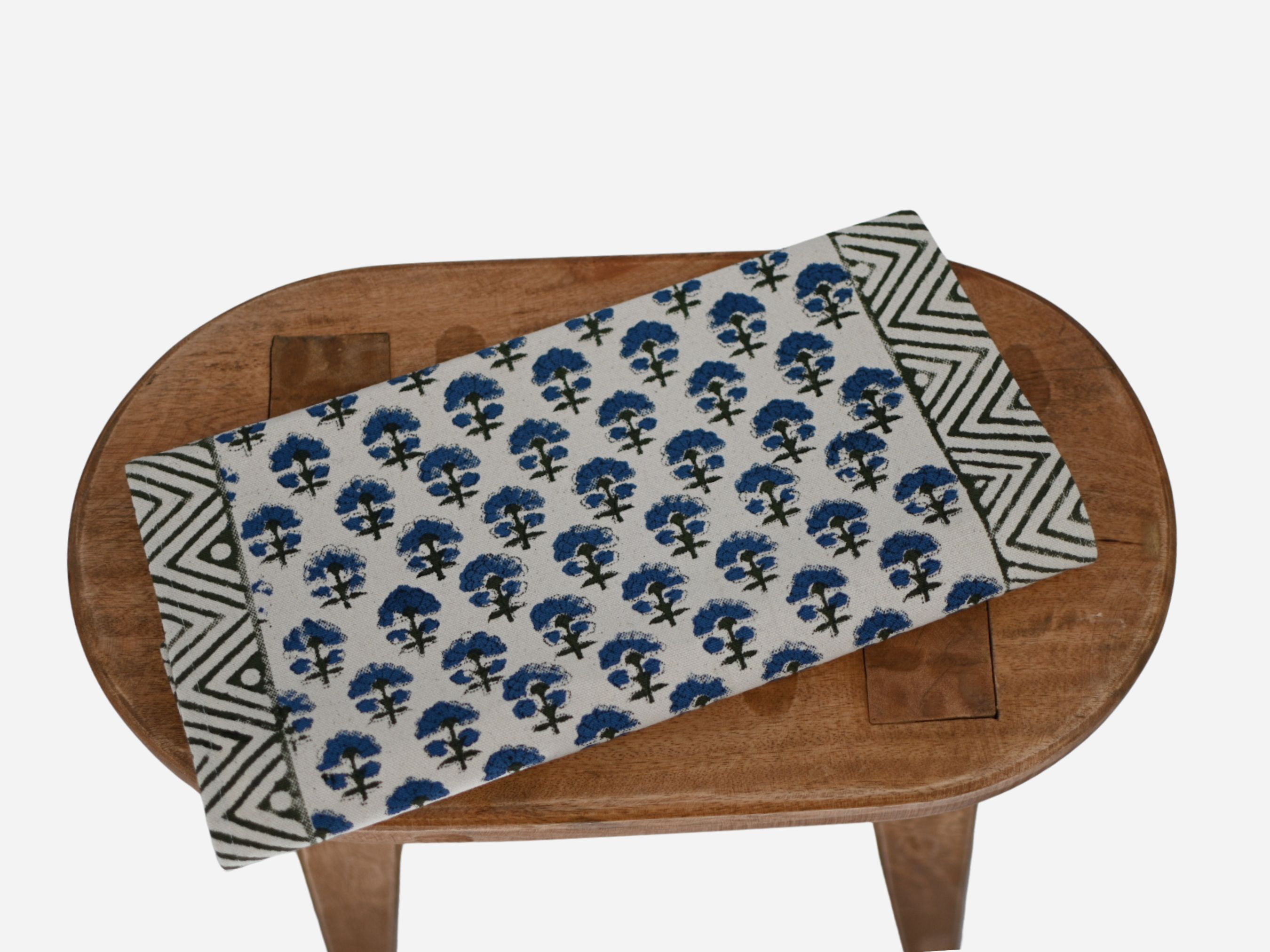 Close‑up of oxford blue floral buti block print on cotton‑linen table runner