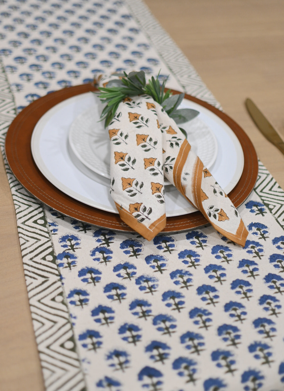 Close‑up of oxford blue floral buti block print on cotton‑linen table runner