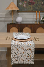 White and amber block printed table runner styled on a dining table