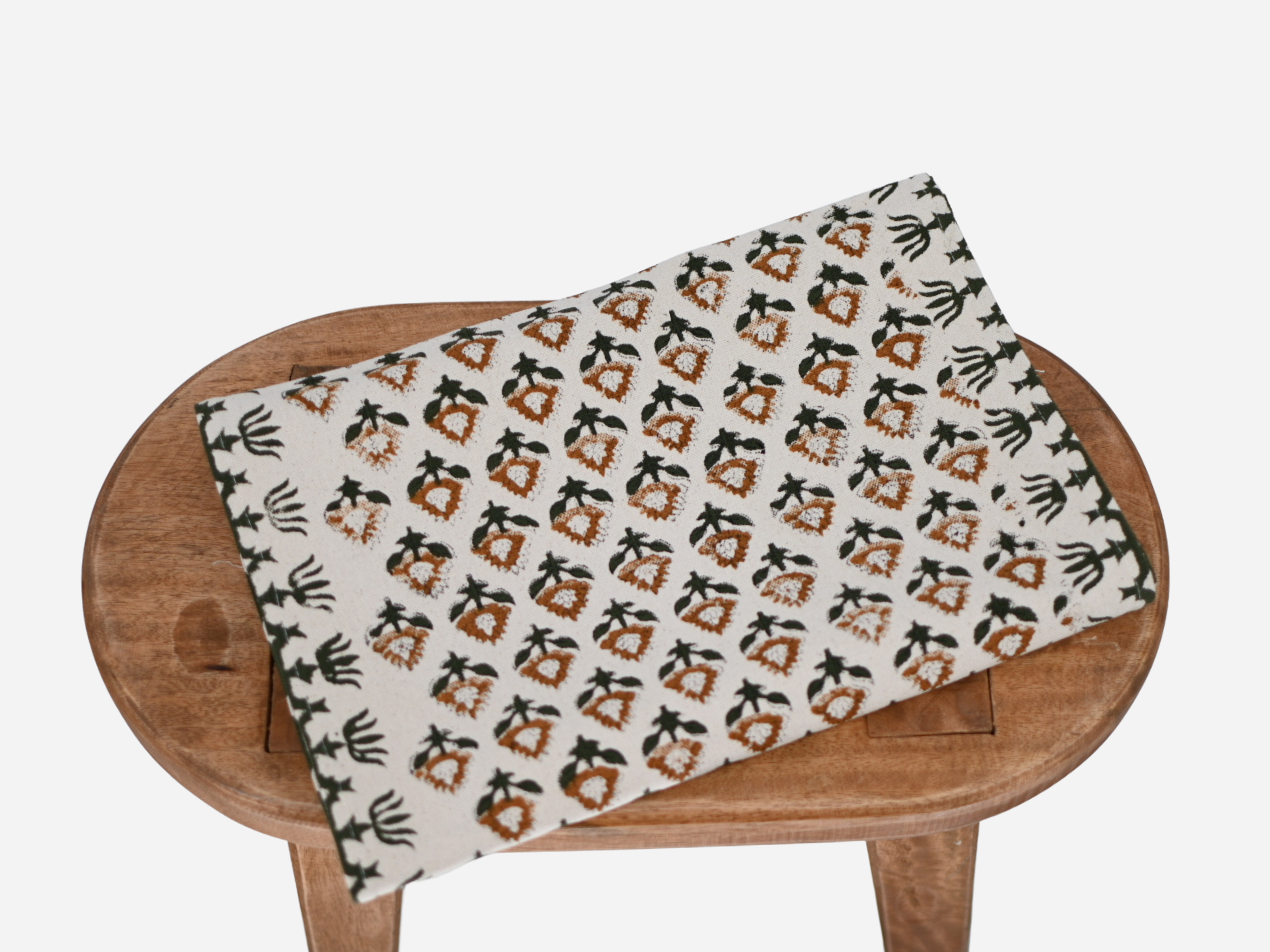 Close‑up of otter brown floral buti block print on cotton‑linen table runner
