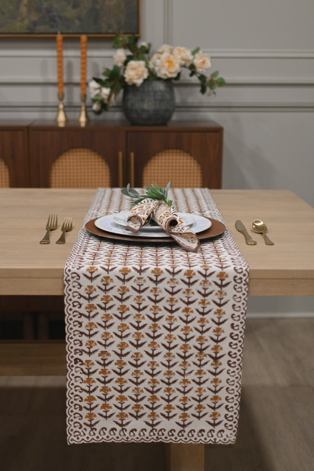 White and amber block printed table runner styled on a dining table