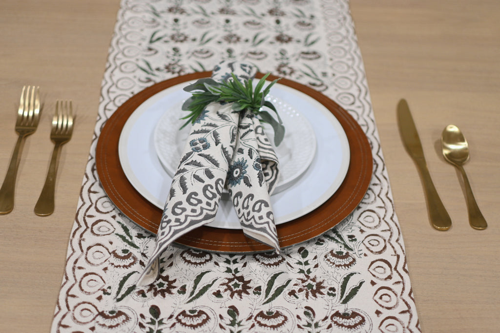 Close‑up of rust brown floral block print on cotton‑linen table runner