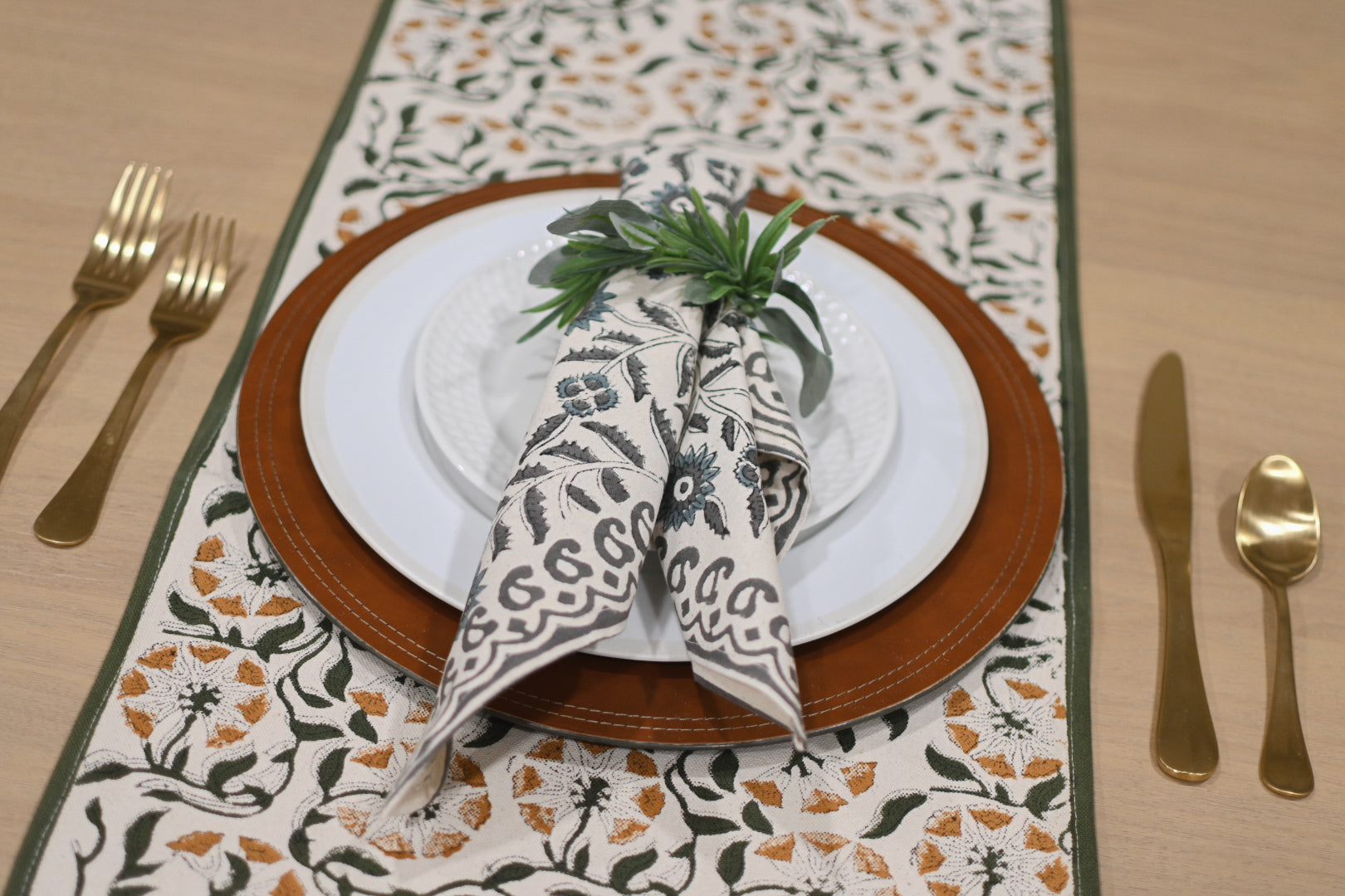 Close‑up of green and gray floral block print on cotton‑linen table runner