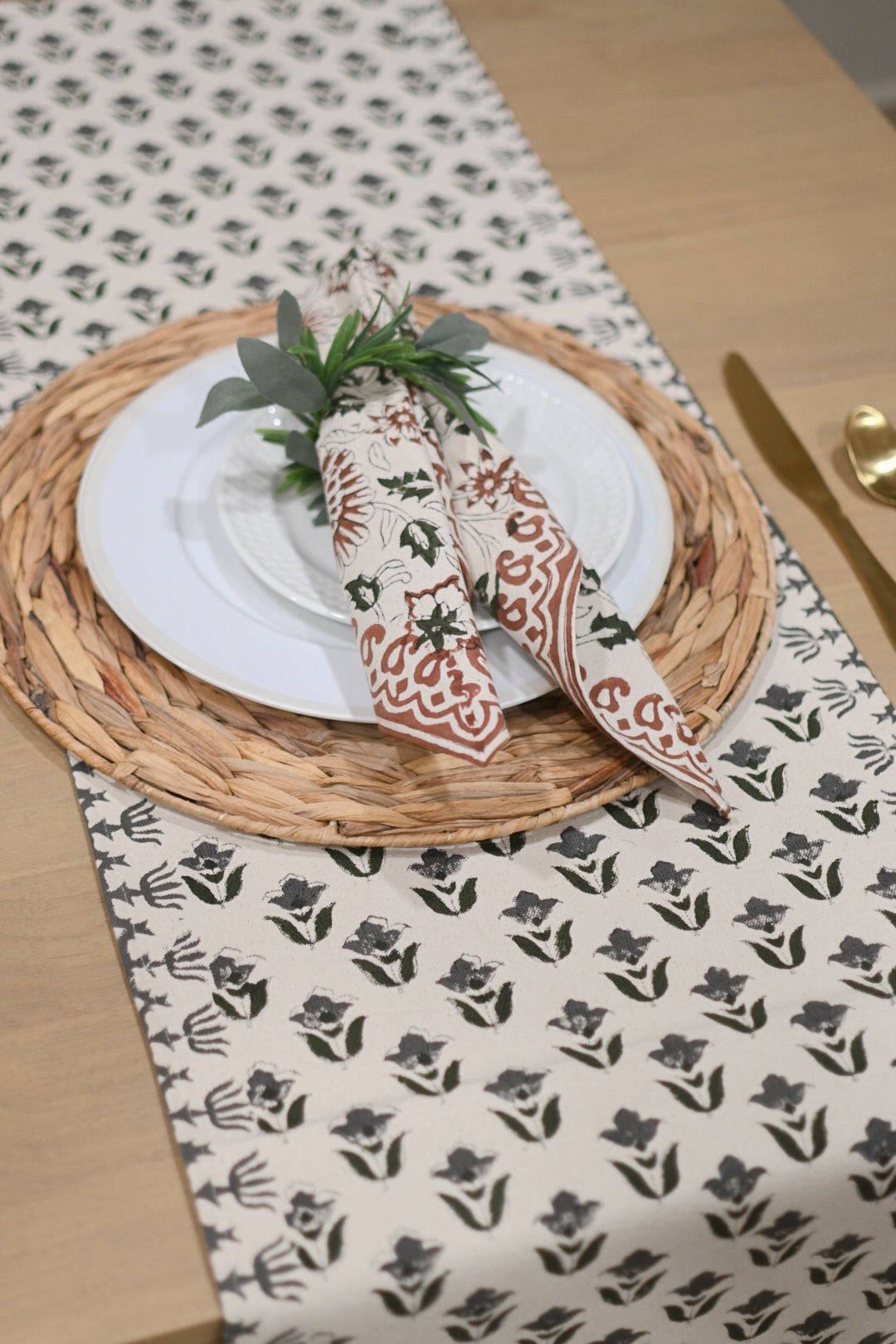 Off white and gray block printed table runner styled on a dining table