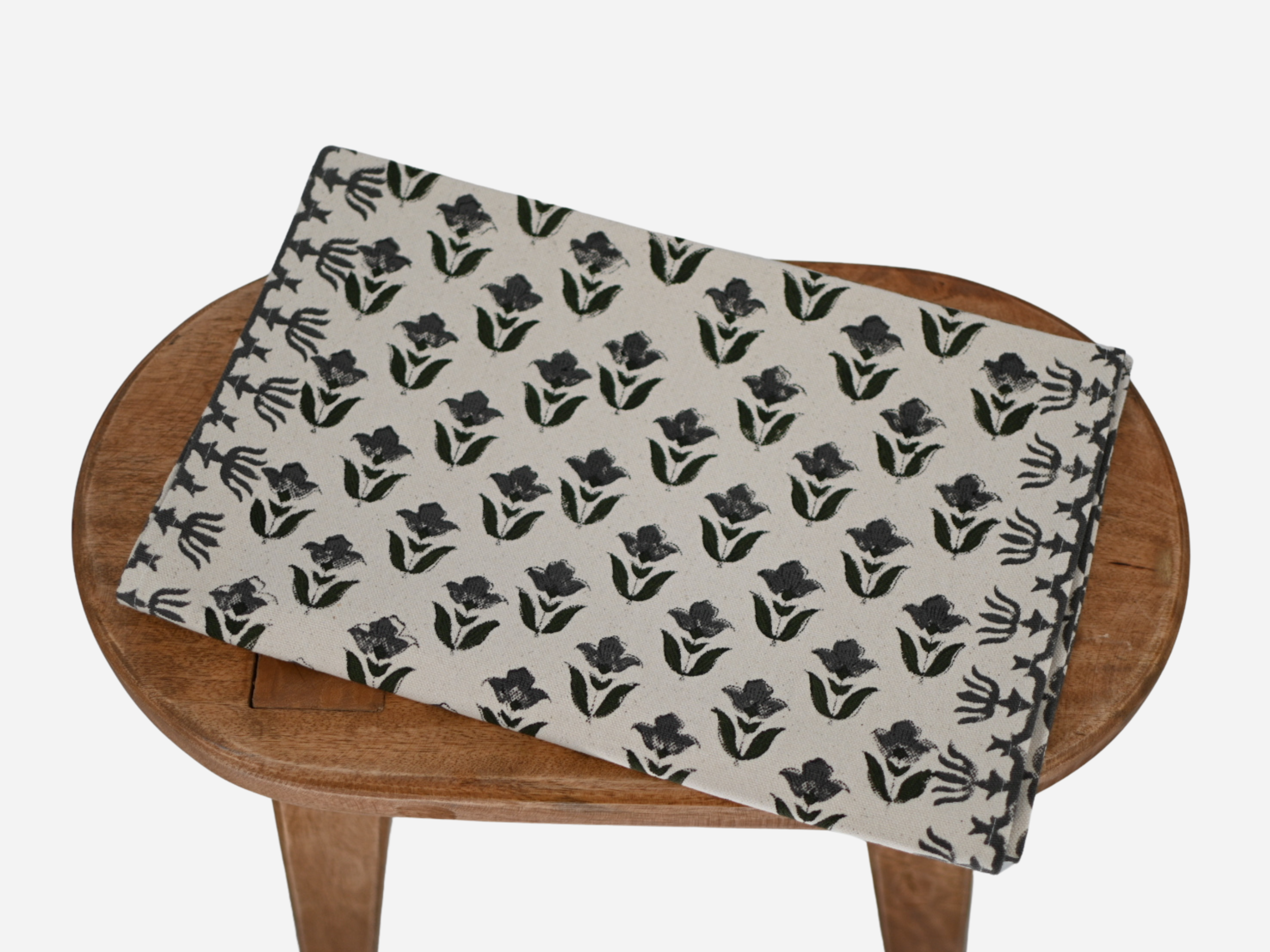 Close‑up of gray floral buti block print on cotton‑linen table runner