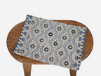 Close‑up of green and blue floral block print on cotton‑linen table runner