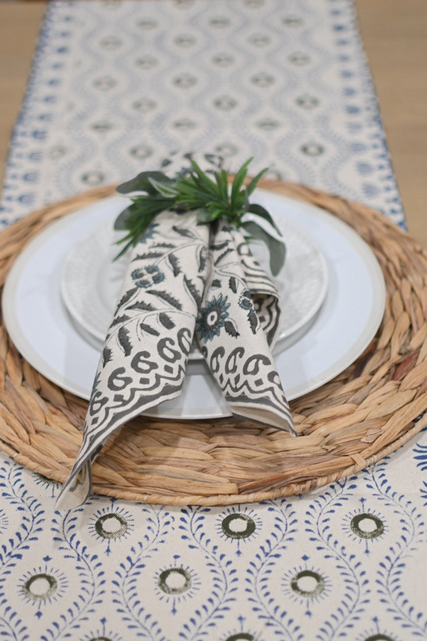 Close‑up of green and blue floral block print on cotton‑linen table runner