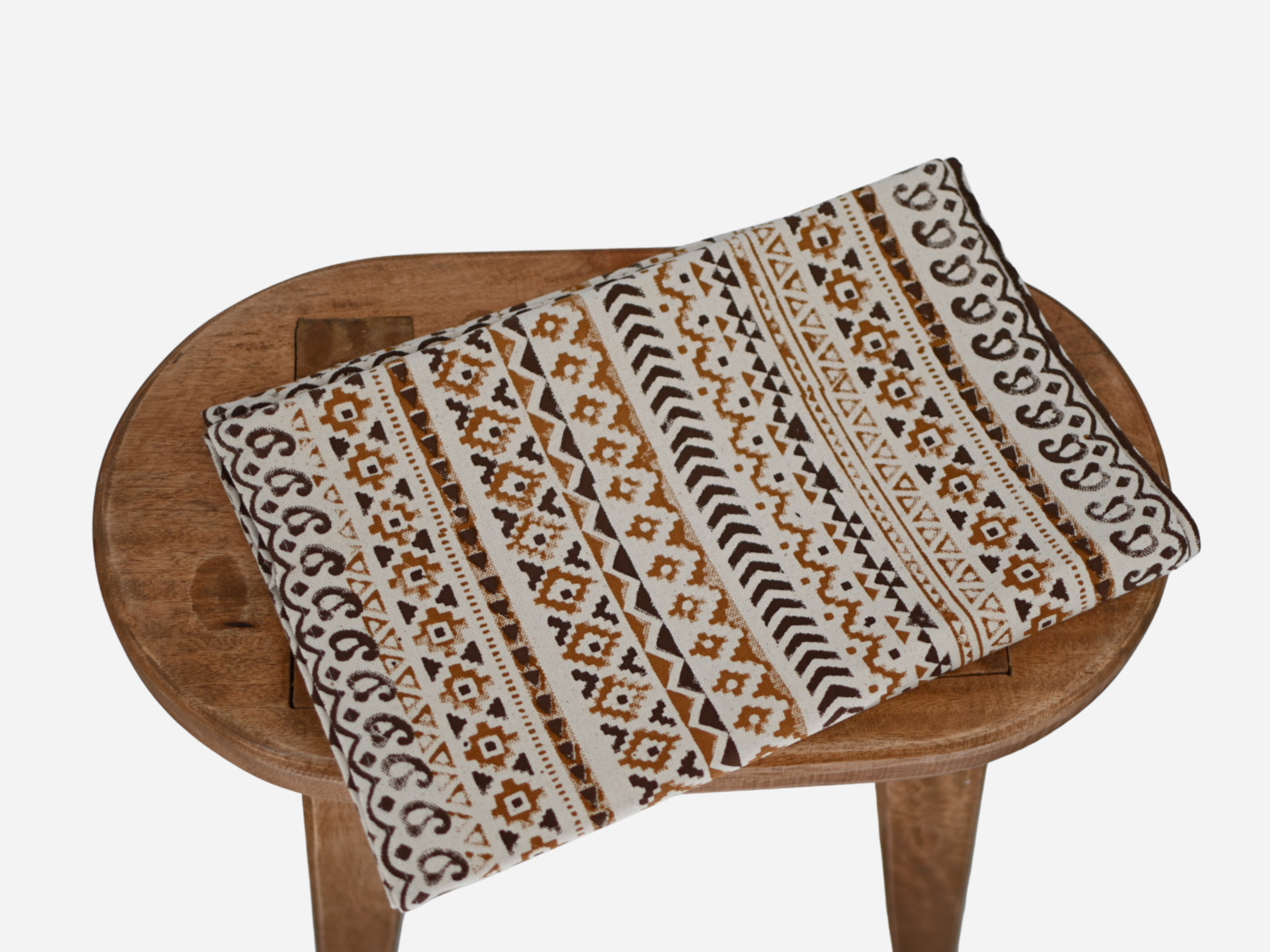 Close‑up of gold mustard geometric block print on cotton‑linen table runner