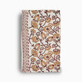 Hand block print table runner in off white with amber gold floral pattern