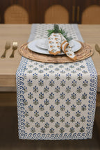 White and blue block printed table runner styled on a dining table