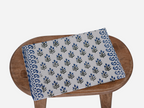 Close‑up of oxford blue floral buti block print on cotton‑linen table runner