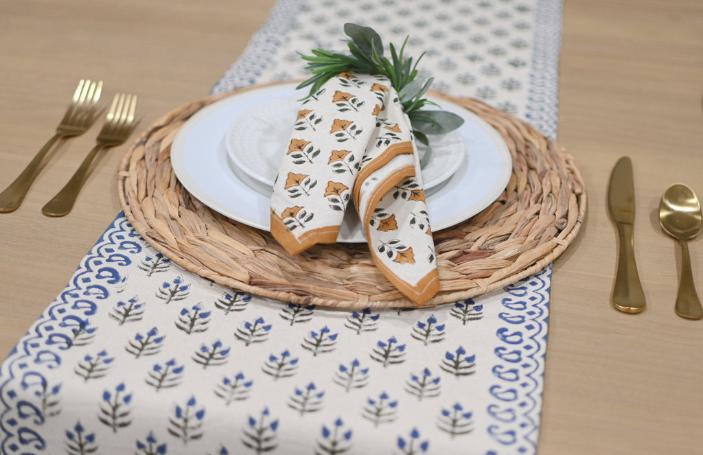 Close‑up of oxford blue floral buti block print on cotton‑linen table runner