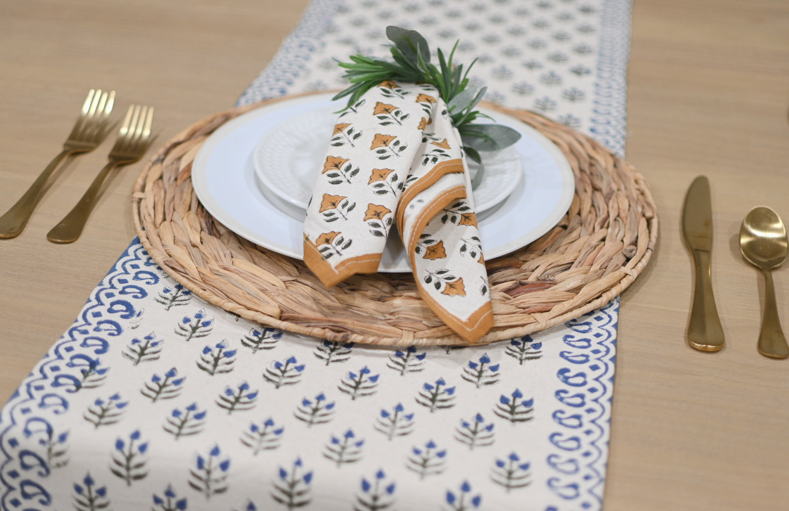 Close‑up of oxford blue floral buti block print on cotton‑linen table runner