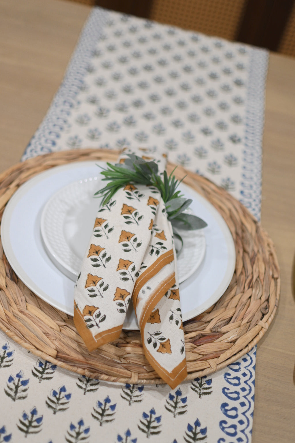 Close‑up of oxford blue floral buti block print on cotton‑linen table runner